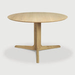 Featuring Corto Dining Table by Ethnicraft at Amethyst Home. Inspired by the vaults within grand architectural designs, the Corto's central-footed base provides both visual interest and practical stability with less leg disturbance for your guests. The solid oak tabletop is crafted into the perfect shape, with unique rounded corners to create welcoming and. Amethyst Home provides interior design, new home construction design consulting, vintage area rugs, and lighting in the Washington metro area.