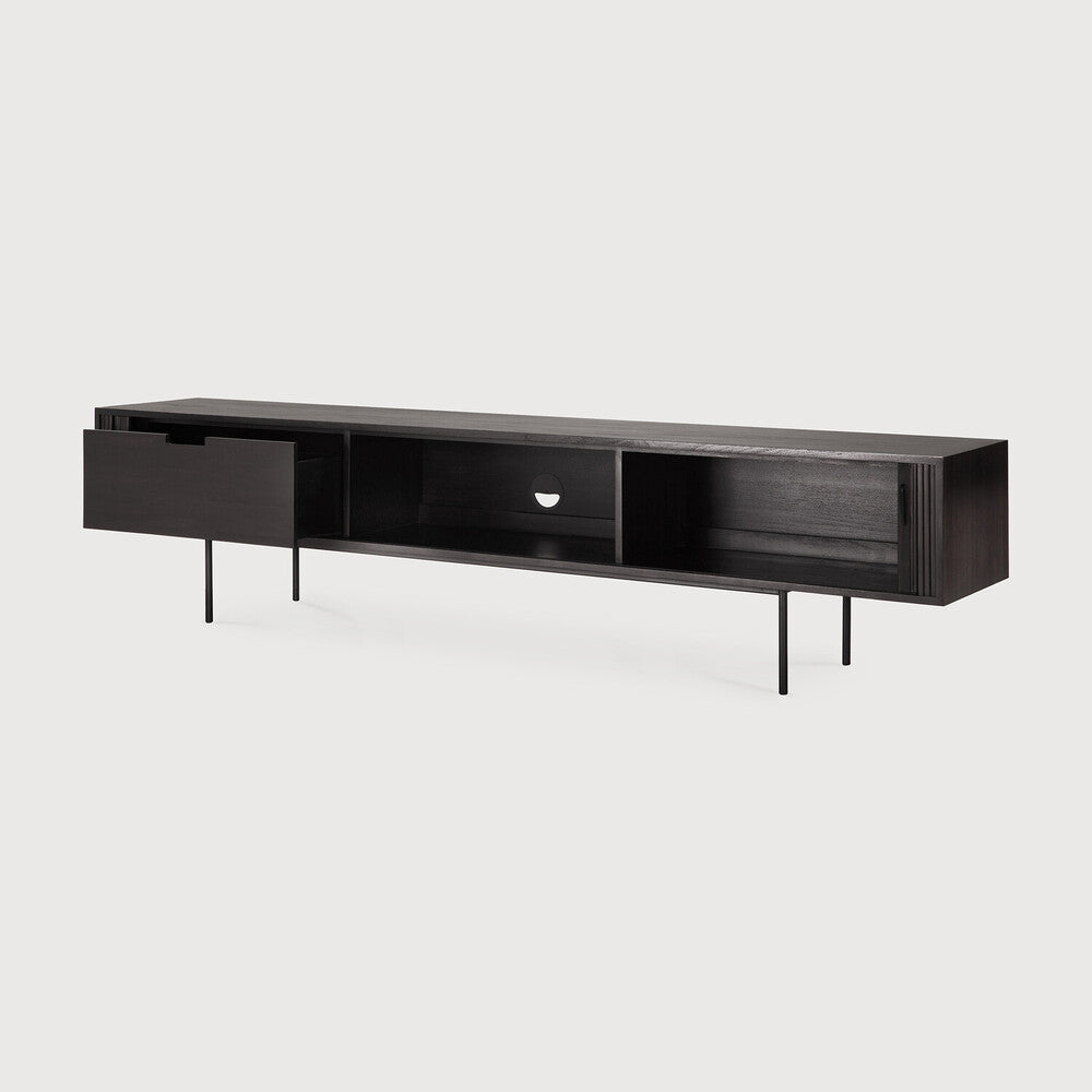 Featuring Roller Max TV Cupboard Teak Black XL by Ethnicraft at Amethyst Home. The Roller Max collection is remarkable in its design, distinguished with its stacked wood-stick effect. The TV cupboard offers functional storage in an eye-catching design, resulting in an elegant and sophisticated item for both residential and commercial spaces.
Overall Dimen. Amethyst Home provides interior design, new home construction design consulting, vintage area rugs, and lighting in the Los Angeles metro area.