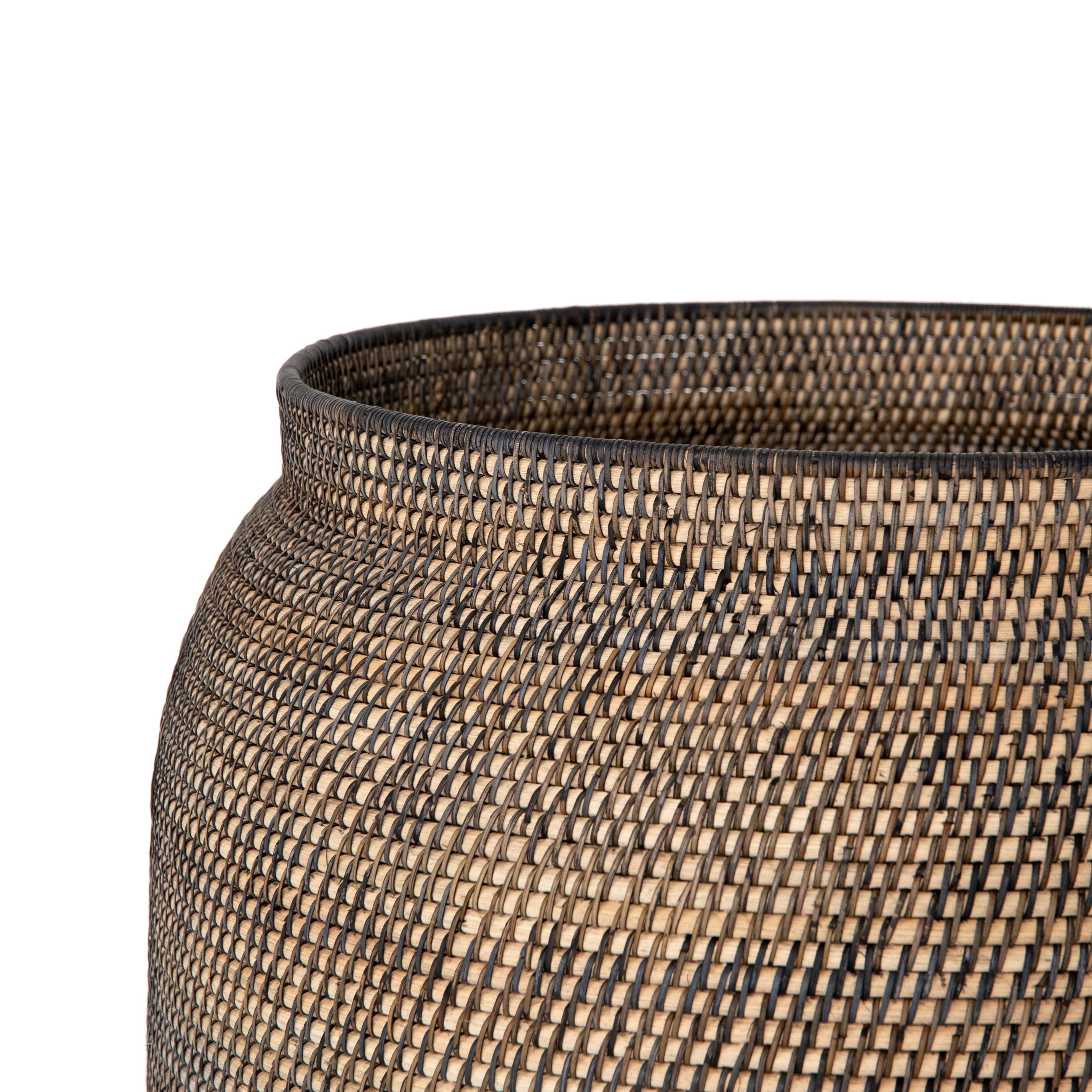 This Ansel Contrast Black Basket is woven from natural Lombok and black rattan, bringing a gorgeous color and texture to the basket. A large, stylish basket to store your pet toys, blankets, or other items around the home.   Overall Dimensions: 24.00"w x 24.00"d x 18.50"h Colors: Natural Lombok Weave, Black Rattan Materials: Lombok, Rattan