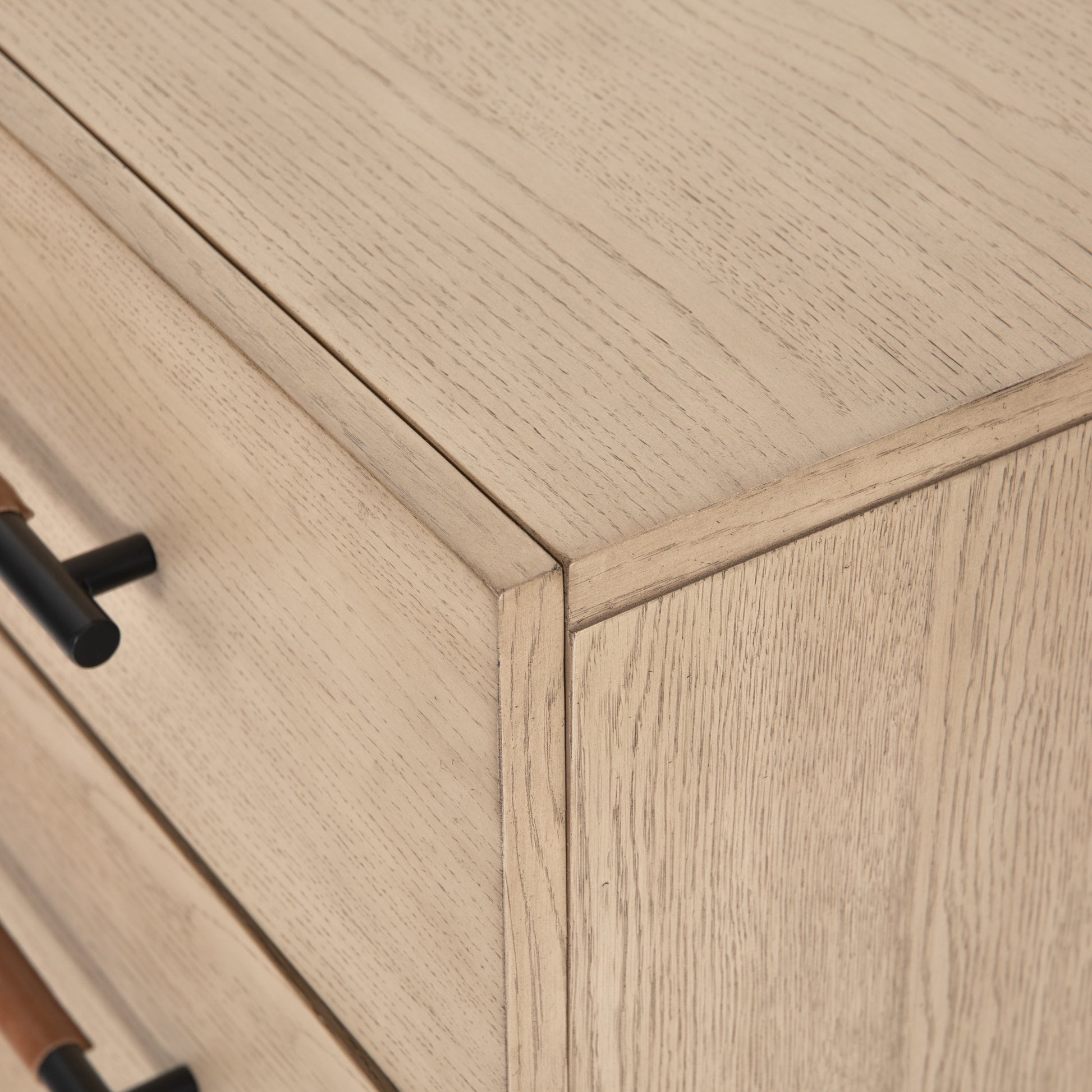 The light-finished oak of this Rosedale 6 Drawer Dresser brings a clean, brightness to any room. With six spacious drawers and iron hardware wrapped in a gorgeous, tan leather,  this is a functional and beautiful piece to add to your bedroom or other area.   Overall Dimensions: 62.50"w x 19.50"d x 33.00"h Materials: Oak Veneer, Top Grain Leather, Iron, Solid Oak