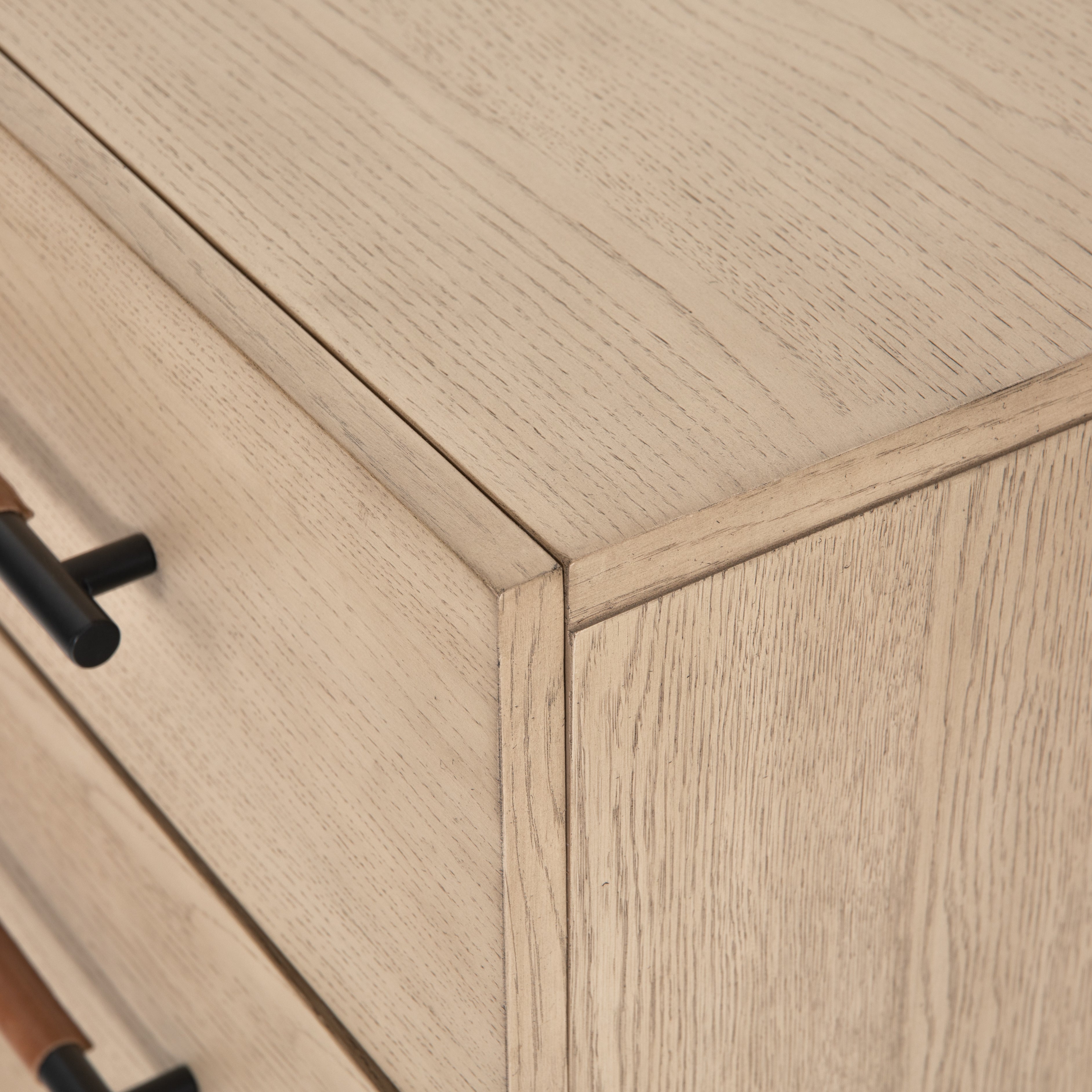 The light-finished oak of this Rosedale 6 Drawer Dresser brings a clean, brightness to any room. With six spacious drawers and iron hardware wrapped in a gorgeous, tan leather,  this is a functional and beautiful piece to add to your bedroom or other area.   Overall Dimensions: 62.50"w x 19.50"d x 33.00"h Materials: Oak Veneer, Top Grain Leather, Iron, Solid Oak