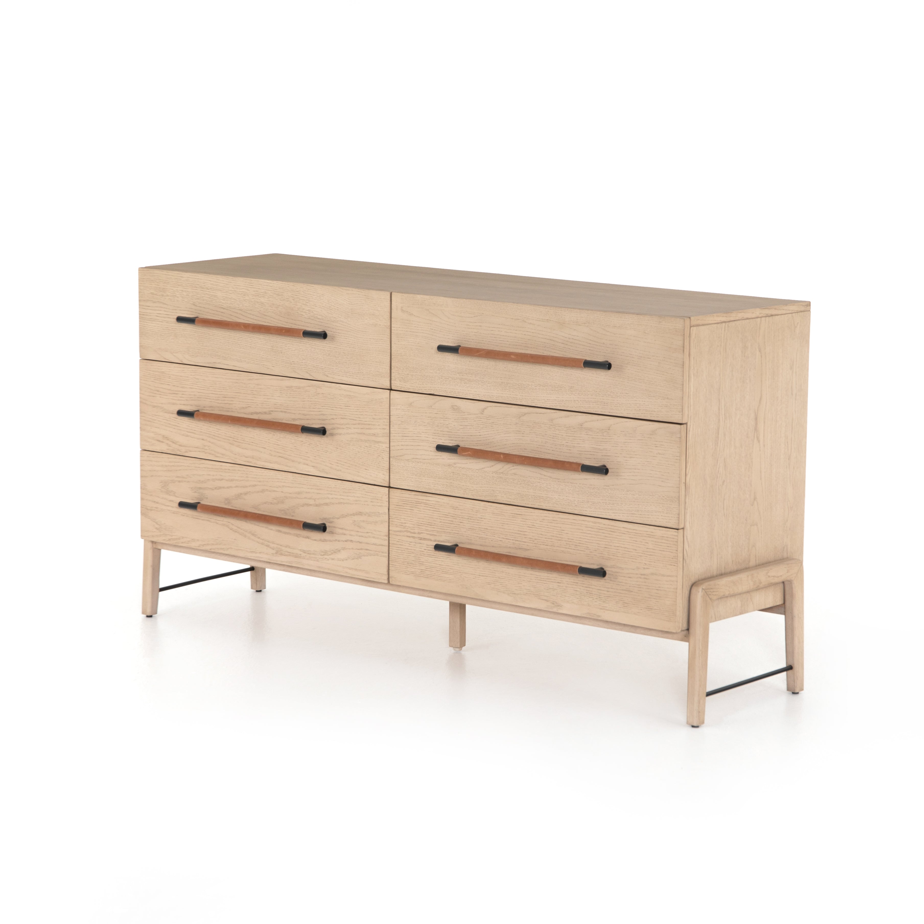 Featuring Rosedale 6 Drawer Dresser by Four Hands at Amethyst Home. The light-finished oak of this Rosedale 6 Drawer Dresser brings a clean, brightness to any room. With six spacious drawers and iron hardware wrapped in a gorgeous, tan leather, this is a functional and beautiful piece to add to your bedroom or other area. 
Overall Dimensions: 62.50"W x 19..  Amethyst Home provides interior design, new home construction design consulting, vintage area rugs, and lighting in the Charlotte metro area.