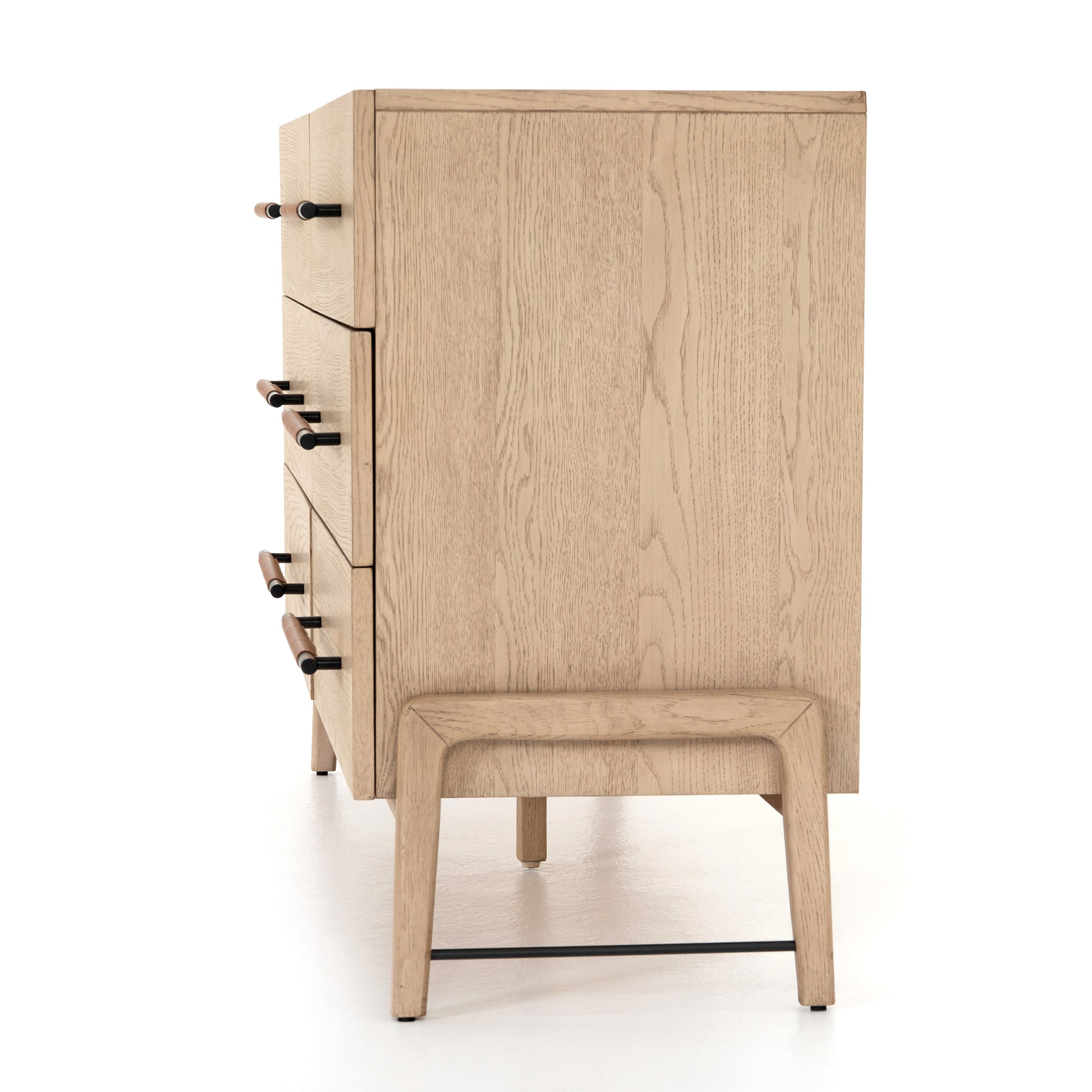 Featuring Rosedale 6 Drawer Dresser by Four Hands at Amethyst Home. The light-finished oak of this Rosedale 6 Drawer Dresser brings a clean, brightness to any room. With six spacious drawers and iron hardware wrapped in a gorgeous, tan leather, this is a functional and beautiful piece to add to your bedroom or other area. 
Overall Dimensions: 62.50"W x.  Amethyst Home provides interior design, new home construction design consulting, vintage area rugs, and lighting in the Newport Beach metro area.