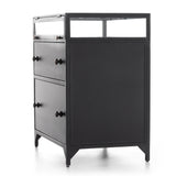 Featuring Shadow Box Nightstand by Four Hands at Amethyst Home. This Shadow Box Nightstand is finished in a gorgeous matte black. We love that the glass top allows you to showcase your favorite jewelry or family keepsake, while the two spacious drawers give you storage space. The knobs are finished in bronze to give this piece a sleek contrast. 
Overall Dimens.  Amethyst Home provides interior design, new home construction design consulting, vintage area rugs, and lighting in the Omaha metro area.