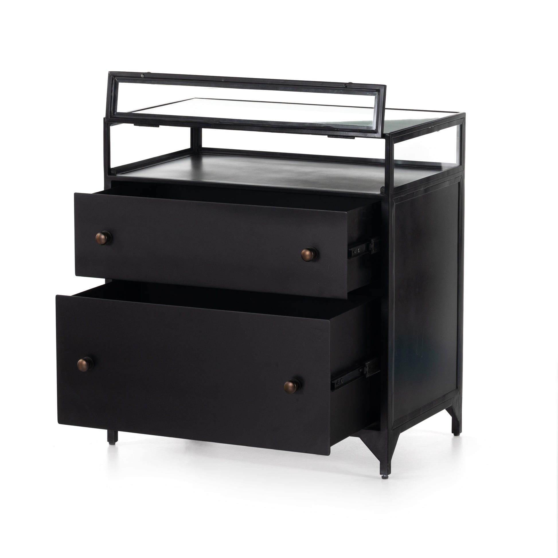 This Shadow Box Nightstand is finished in a gorgeous matte black. We love that the glass top allows you to showcase your favorite jewelry or family keepsake, while the two spacious drawers give you storage space. The knobs are finished in bronze to give this piece a sleek contrast.  Overall Dimensions: 28.00"w x 17.75"d x 30.00"h Materials: Iron, Tempered Glass, Glass