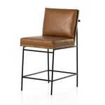 Crisp and clean, with natural panache. Slim, black-finished iron frames a floating ladderback of amber-finished oak and faux leather seating. Rear handle detail adds a fashionable finishing touch. Amethyst Home provides interior design, new home construction design consulting, vintage area rugs, and lighting in the Des Moines metro area.
