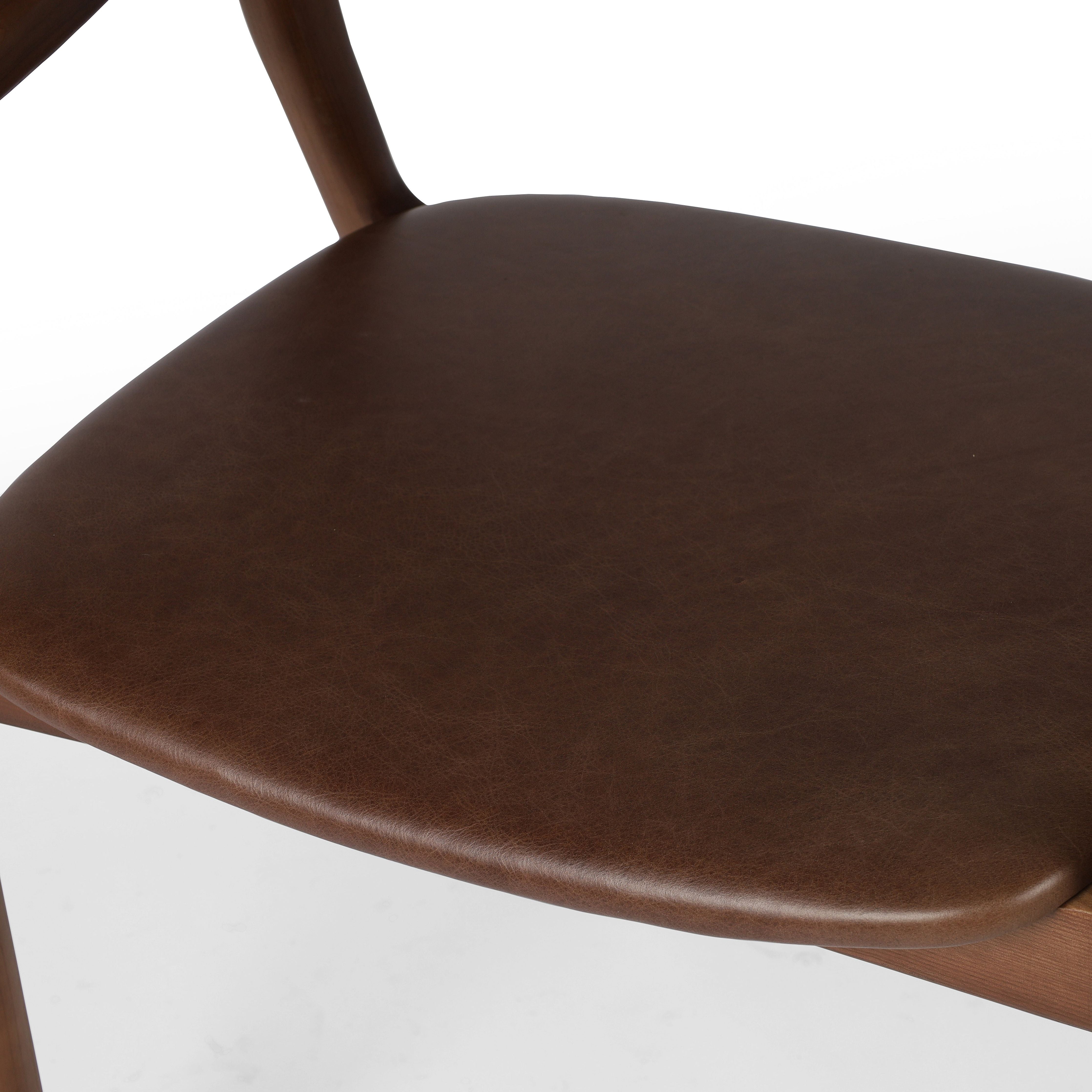 Make it monochromatic. Inspired by simple Scandinavian styling, solid ash forms a shapely open frame for top-grain leather seating. Amethyst Home provides interior design, new construction, custom furniture and area rugs in the Austin metro area