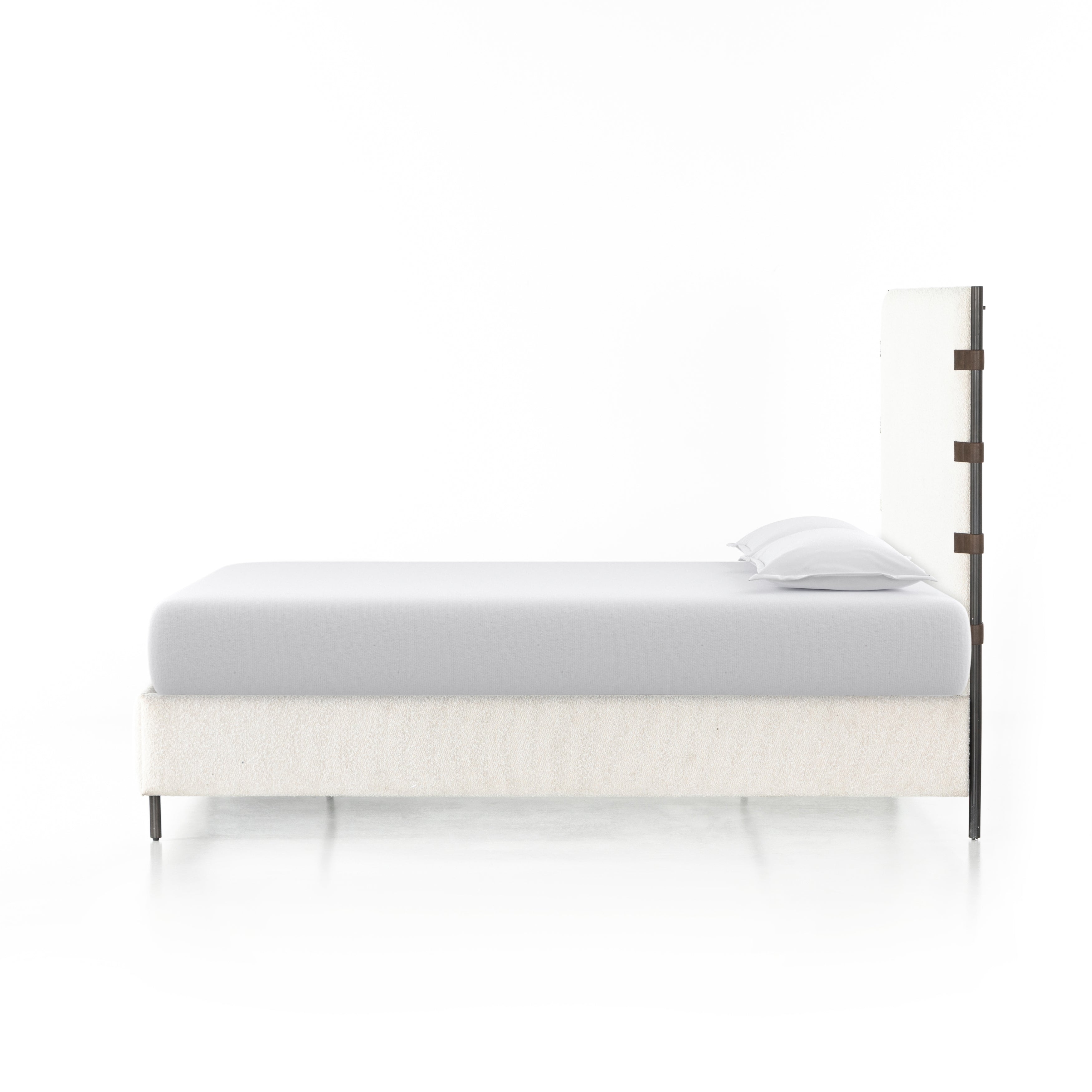 Bring texture into play. Upholstered in a classic cream-colored boucle, with decorative leather straps adding a material-driven touch with contrast. Standard box spring required. Amethyst Home provides interior design services, furniture, rugs, and lighting in the Winter Garden metro area.