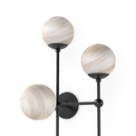 Featuring Armstrong Black Gunmetal Marbled Matte Glass 4 R Sconce by Four Hands at Amethyst Home. Marbled glass spheres seem to extend and reach across smooth brass rods. Each globe is individually blown, shaped and sculpted by hand through a one-hour process. The finish on the brass frame is achieved through a specialized process that turns the brass . Amethyst Home provides interior design, new home construction design consulting, vintage area rugs, and lighting in the Salt Lake City metro area.