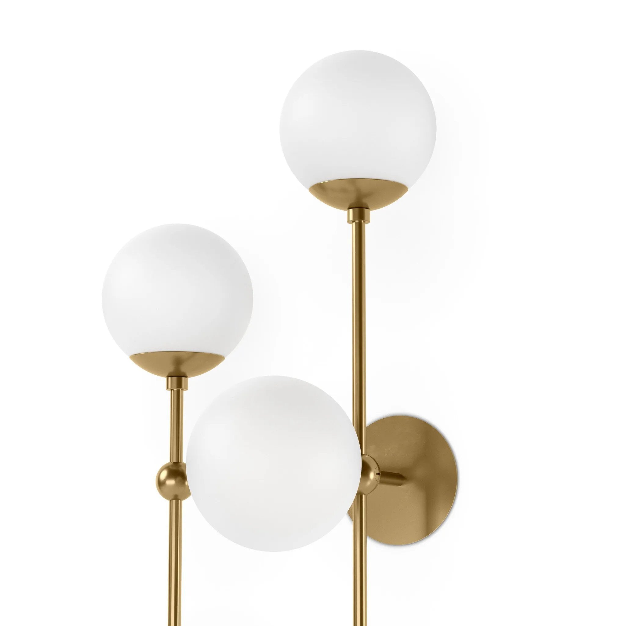 Featuring Armstrong Burnished Brass Opal Matte Glass 4 L Sconce by Four Hands at Amethyst Home. Matte glass spheres seem to extend and reach across smooth brass rods. Each globe is individually blown, shaped and sculpted by hand through a one-hour process. Matte globes are specially manufactured to evenly diffuse light. Brass and glass are 98% recyclable.. Amethyst Home provides interior design, new home construction design consulting, vintage area rugs, and lighting in the Kansas City metro area.
