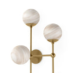 Featuring Armstrong Burnished Brass Marbled Matte Glass 4 R Sconce by Four Hands at Amethyst Home. Marbled glass spheres seem to extend and reach across smooth brass rods. Each globe is individually blown, shaped and sculpted by hand through a one-hour process. Brass and glass are 98% recyclable. Designed and sustainably made in Poland by Schwung.
Overall Dim. Amethyst Home provides interior design, new home construction design consulting, vintage area rugs, and lighting in the Houston metro area.