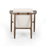 Featuring Arnett Chair by Four Hands at Amethyst Home. Textural cream boucle seating offers a sumptuous sit, with complementary wire-brushed parawood framing forming a slim U shape. Two posterior top-grain leather straps add a stylish finishing touch. Performance fabrics are specially created to withstand spills, stains, high traffic and wear, ensuring long-term comfort and unmatc. Amethyst Home provides interior design, new construction, custom furniture and area rugs in the Des Moines metro area