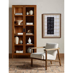 Featuring Arnett Chair by Four Hands at Amethyst Home. Textural cream boucle seating offers a sumptuous sit, with complementary wire-brushed parawood framing forming a slim U shape. Two posterior top-grain leather straps add a stylish finishing touch. Performance fabrics are specially created to withstand spills, stains, high traffic and wear, ensuring long-term comfort and unma. Amethyst Home provides interior design, new construction, custom furniture and area rugs in the Laguna Beach metro area