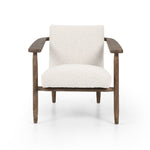 Featuring Arnett Chair by Four Hands at Amethyst Home. Textural cream boucle seating offers a sumptuous sit, with complementary wire-brushed parawood framing forming a slim U shape. Two posterior top-grain leather straps add a stylish finishing touch. Performance fabrics are specially created to withstand spills, stains, high traffic and wear, ensuring long-term comfort and unmatche. Amethyst Home provides interior design, new construction, custom furniture and area rugs in the Monterey metro area