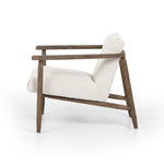 Featuring Arnett Chair by Four Hands at Amethyst Home. Textural cream boucle seating offers a sumptuous sit, with complementary wire-brushed parawood framing forming a slim U shape. Two posterior top-grain leather straps add a stylish finishing touch. Performance fabrics are specially created to withstand spills, stains, high traffic and wear, ensuring long-term comfort and unmatch. Amethyst Home provides interior design, new construction, custom furniture and area rugs in the Park City metro area