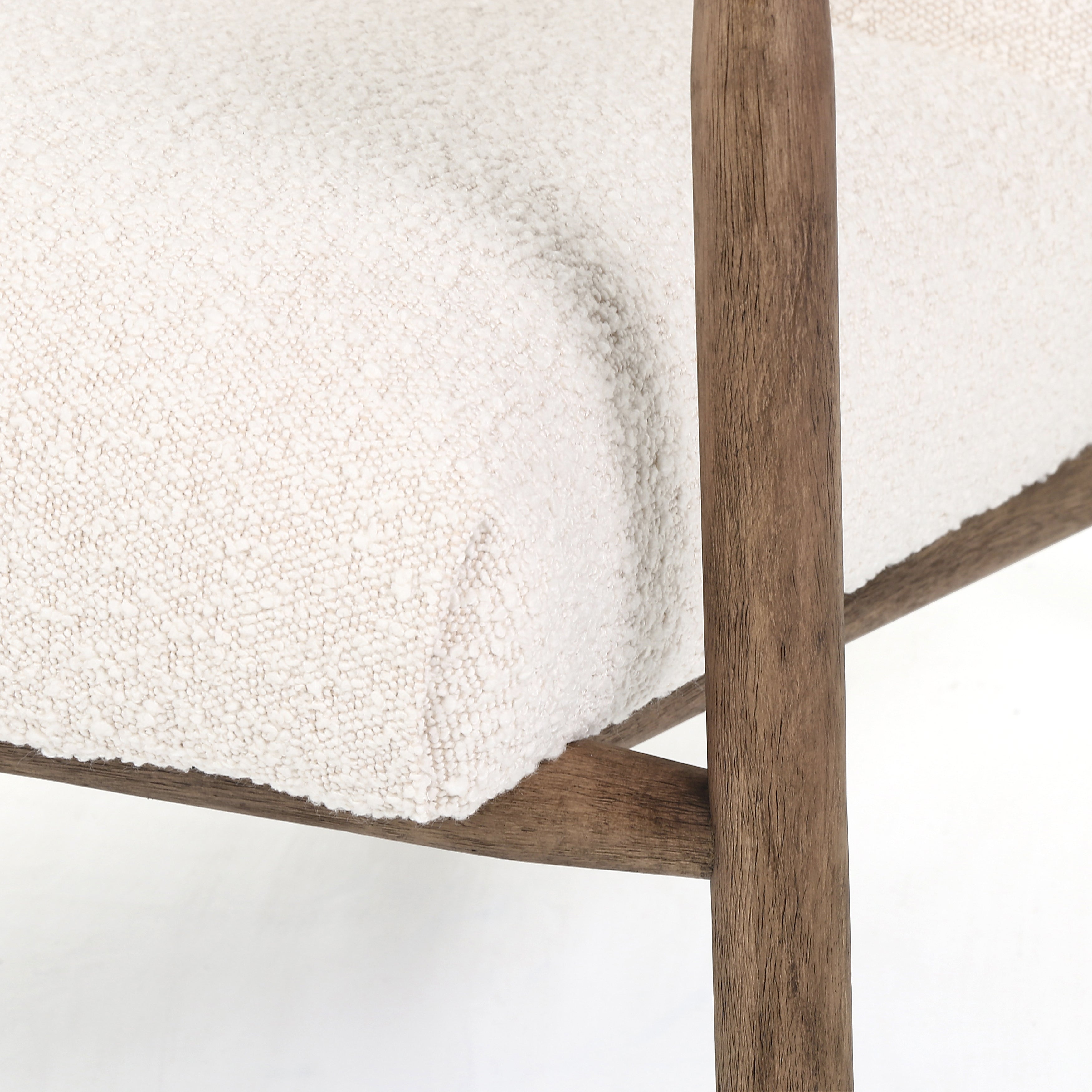 Featuring Arnett Chair by Four Hands at Amethyst Home. Textural cream boucle seating offers a sumptuous sit, with complementary wire-brushed parawood framing forming a slim U shape. Two posterior top-grain leather straps add a stylish finishing touch. Performance fabrics are specially created to withstand spills, stains, high traffic and wear, ensuring long-term comfort and un. Amethyst Home provides interior design, new construction, custom furniture and area rugs in the Salt Lake City metro area