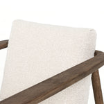 Featuring Arnett Chair by Four Hands at Amethyst Home. Textural cream boucle seating offers a sumptuous sit, with complementary wire-brushed parawood framing forming a slim U shape. Two posterior top-grain leather straps add a stylish finishing touch. Performance fabrics are specially created to withstand spills, stains, high traffic and wear, ensuring long-term comfort and unmatc. Amethyst Home provides interior design, new construction, custom furniture and area rugs in the Scottsdale metro area