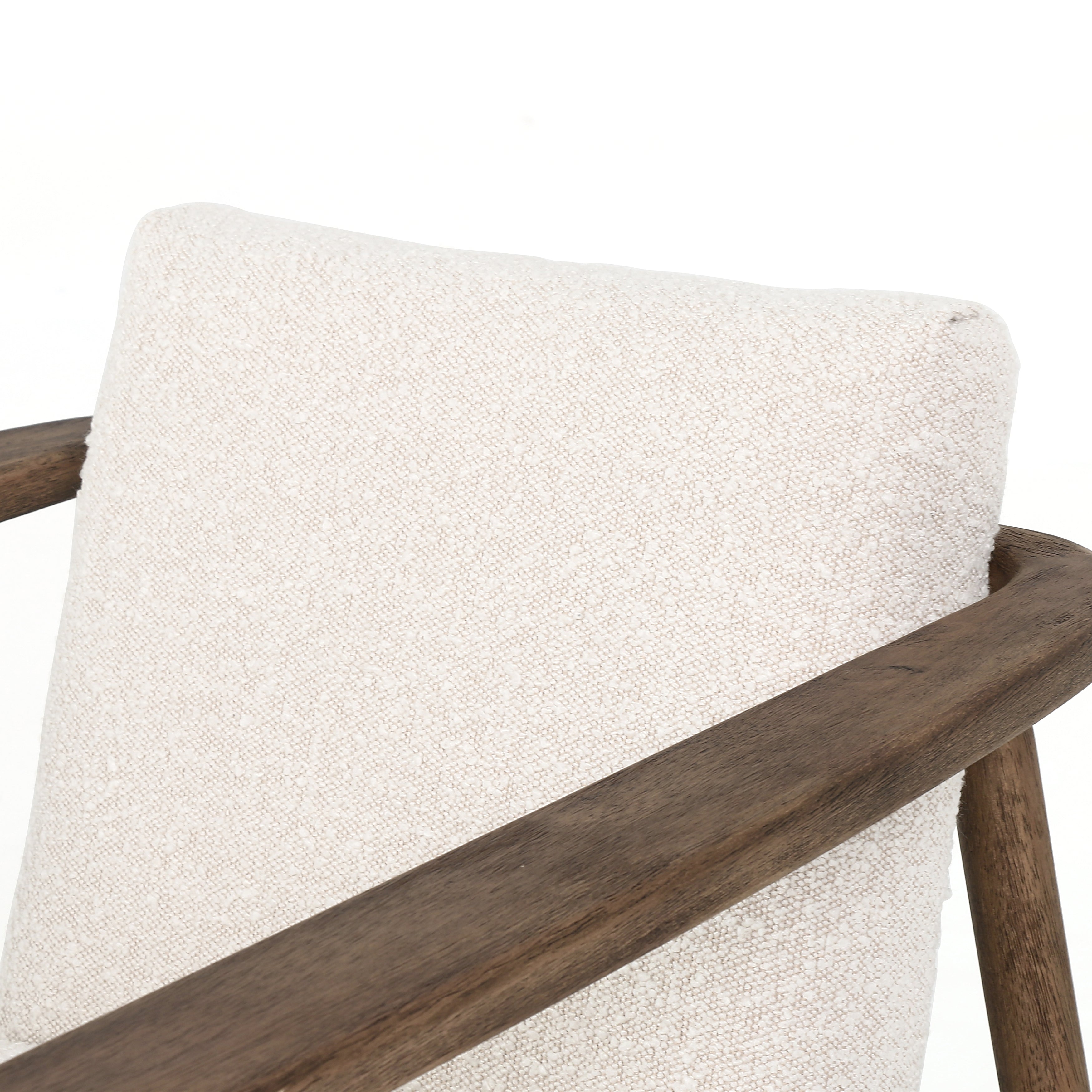 Featuring Arnett Chair by Four Hands at Amethyst Home. Textural cream boucle seating offers a sumptuous sit, with complementary wire-brushed parawood framing forming a slim U shape. Two posterior top-grain leather straps add a stylish finishing touch. Performance fabrics are specially created to withstand spills, stains, high traffic and wear, ensuring long-term comfort and unmatc. Amethyst Home provides interior design, new construction, custom furniture and area rugs in the Scottsdale metro area