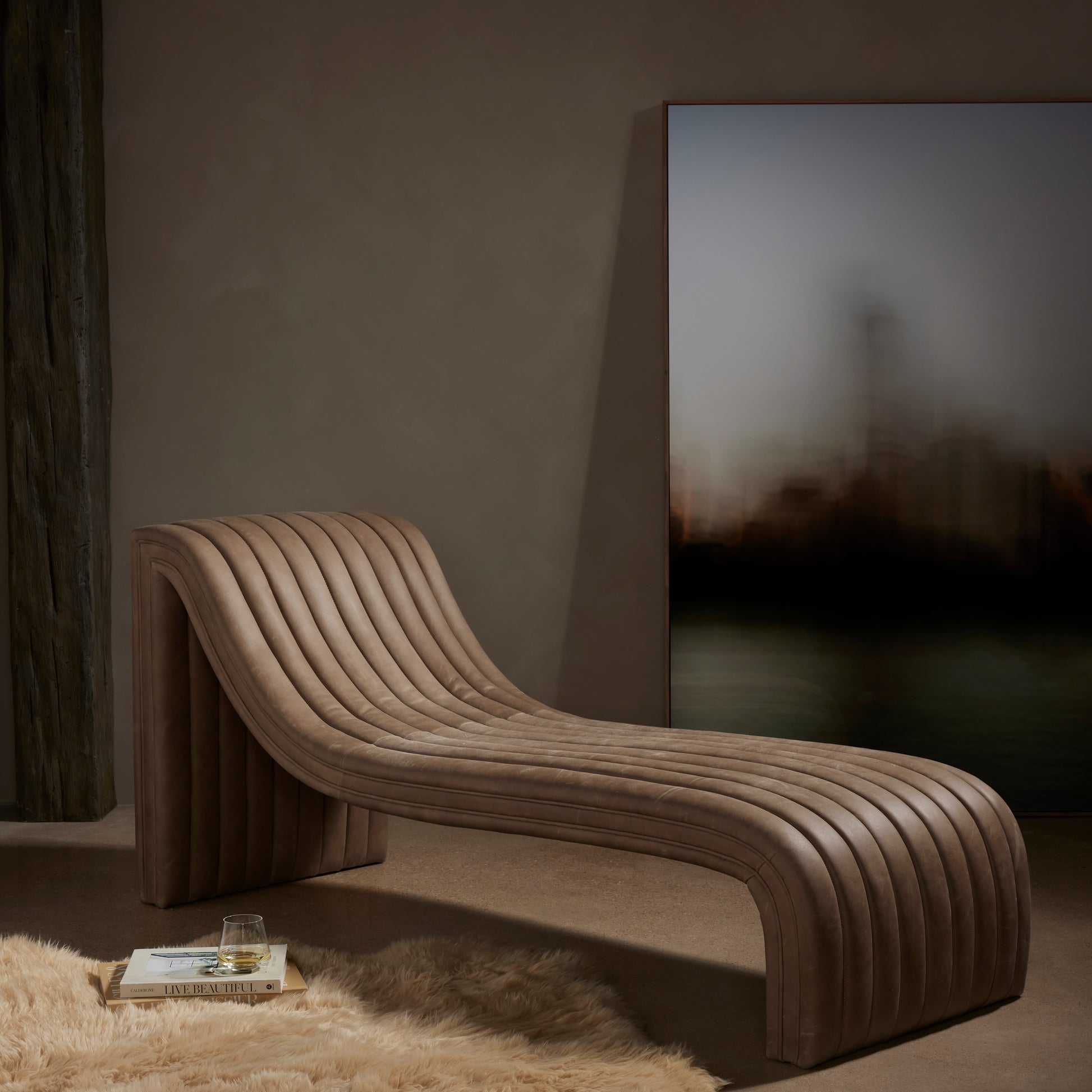 Augustine Palermo Drift Chaise Lounge is amodern take on the classic chaise, top-grain leather adopts dramatic linear channeling for texture and comfort alike. Amethyst Home provides interior design services, furniture, rugs, and lighting in the Seattle metro area.