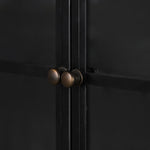 Display barware, books and keepsakes in wide, beautifully arched cabinetry. Solid iron sheeting is finished in a soft, matte black with contrasting brass hardware. Amethyst Home provides interior design, new construction, custom furniture, and area rugs in the San Diego metro area.