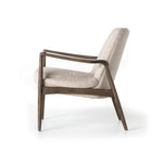 Dramatic arms and a deeper seat offer relaxation with mid-century modern sophistication. Sculpted frame adds an architectural feel to light camel upholstery. Amethyst Home provides interior design, new construction, custom furniture, and area rugs in the Seattle metro area.