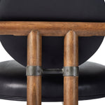Featuring Bria Heirloom Black Chair by Four Hands at Amethyst Home. A playful take on Italian modernism. Solid parawood crafts a slim, curved frame and rear mock-tripod. Upholstered in black top-grain leather. Sourced from one of the oldest family-owned tanneries in Italy’s Bassano del Grappa, our heirloom leather covering is salvaged and processed from up. Amethyst Home provides interior design, new home construction design consulting, vintage area rugs, and lighting in the Scottsdale metro area.