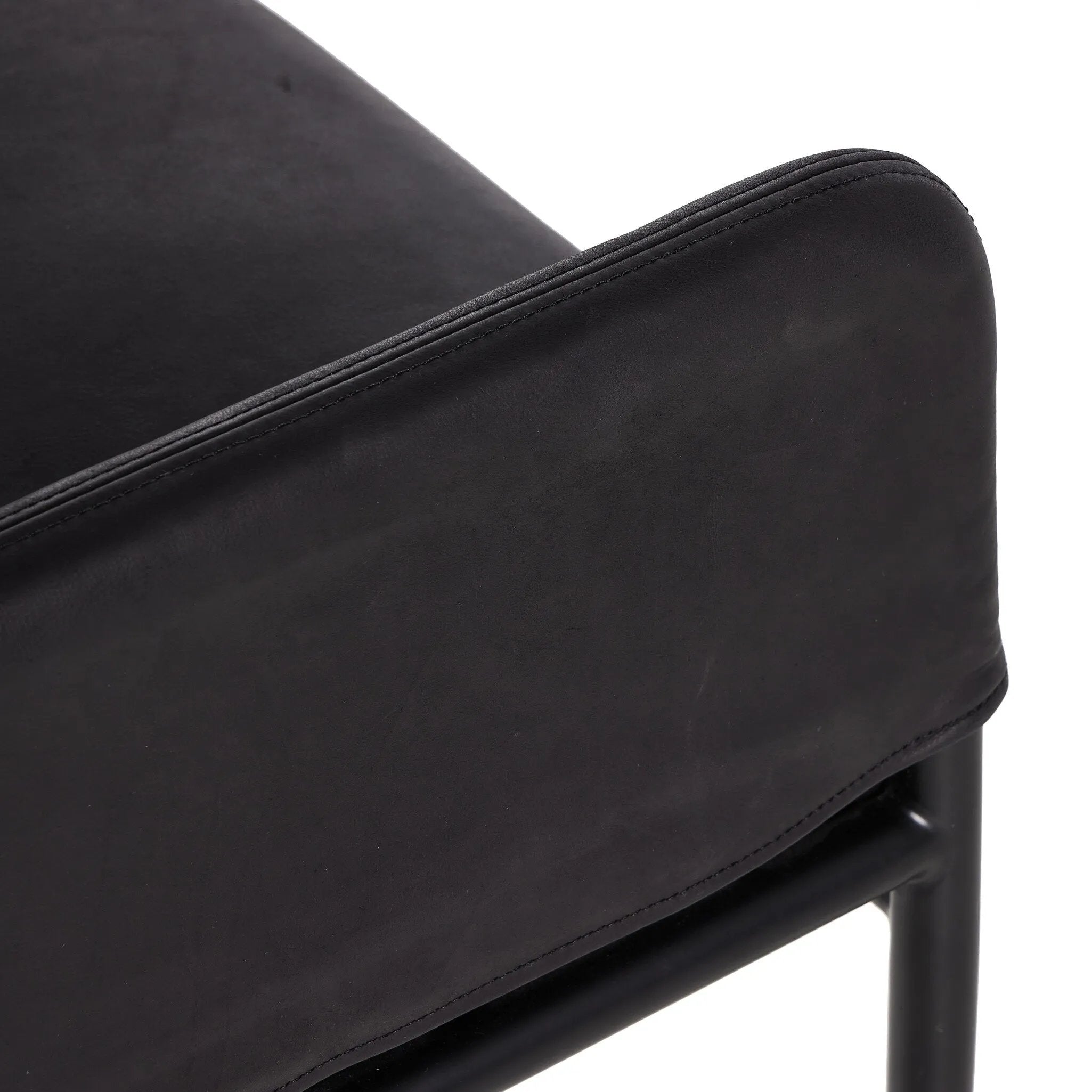 Featuring Brickel Heirloom Black Dining Backless Bench by Four Hands at Amethyst Home. Black top-grain leather steals the show in this sleek, simple bench. Sourced from one of the oldest family-owned tanneries in Italy's Bassano del Grappa, heirloom leather is salvaged and processed from upcycled hides featuring an abundance of natural markings, scars and colo. Amethyst Home provides interior design, new home construction design consulting, vintage area rugs, and lighting in the Austin metro area.