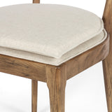 Mixed materials refresh retro dining style. Light-toasted nettlewood frames a textural inlay of natural cane, for perfect contrast. Fastened by Velcro, high-performance linen-blend seating for modern sensibility. Amethyst Home provides interior design, new home construction design consulting, vintage area rugs, and lighting in the Charlotte metro area.