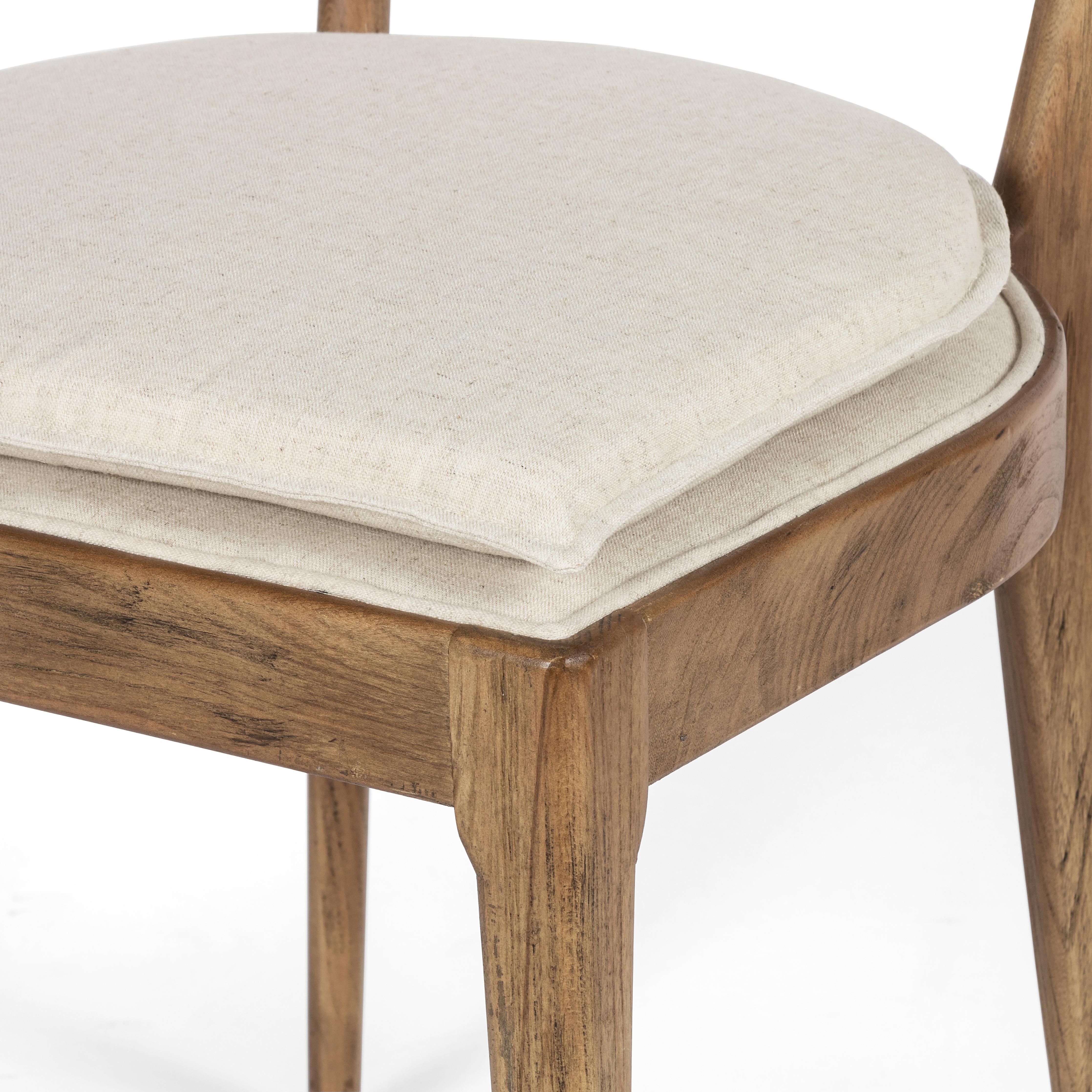 Mixed materials refresh retro dining style. Light-toasted nettlewood frames a textural inlay of natural cane, for perfect contrast. Fastened by Velcro, high-performance linen-blend seating for modern sensibility. Amethyst Home provides interior design, new home construction design consulting, vintage area rugs, and lighting in the Charlotte metro area.