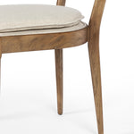 Mixed materials refresh retro dining style. Light-toasted nettlewood frames a textural inlay of natural cane, for perfect contrast. Fastened by Velcro, high-performance linen-blend seating for modern sensibility. Amethyst Home provides interior design, new home construction design consulting, vintage area rugs, and lighting in the Dallas metro area.