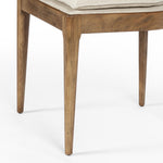 Mixed materials refresh retro dining style. Light-toasted nettlewood frames a textural inlay of natural cane, for perfect contrast. Fastened by Velcro, high-performance linen-blend seating for modern sensibility. Amethyst Home provides interior design, new home construction design consulting, vintage area rugs, and lighting in the Laguna Beach metro area.