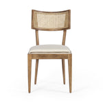 Mixed materials refresh retro dining style. Light-toasted nettlewood frames a textural inlay of natural cane, for perfect contrast. Fastened by Velcro, high-performance linen-blend seating for modern sensibility. Amethyst Home provides interior design, new home construction design consulting, vintage area rugs, and lighting in the Winter Garden metro area.