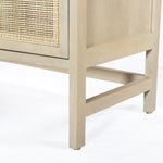 Monochromatic with a textural twist. Natural mango frames woven cane fronts, with black iron hardware for subtle contrast. Inside, spacious shelving awaits storage of dinnerware and more Amethyst Home provides interior design, new home construction design consulting, vintage area rugs, and lighting in the Newport Beach metro area.