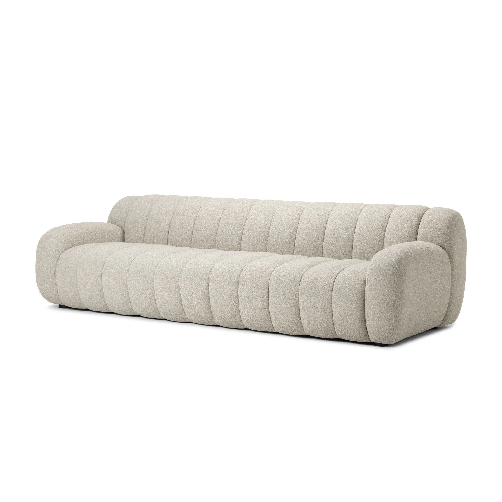 Grand in scale and comfort, this plush sofa features wide dramatic channeling for extra volume and a cloud-like look and sit. Covered in a recycled olefin fabric, known for its UV-resistant, water-repellent and quick-drying abilities, in a Turkish weave with a classic tweed feel.Collection: Osl Amethyst Home provides interior design, new home construction design consulting, vintage area rugs, and lighting in the Miami metro area.