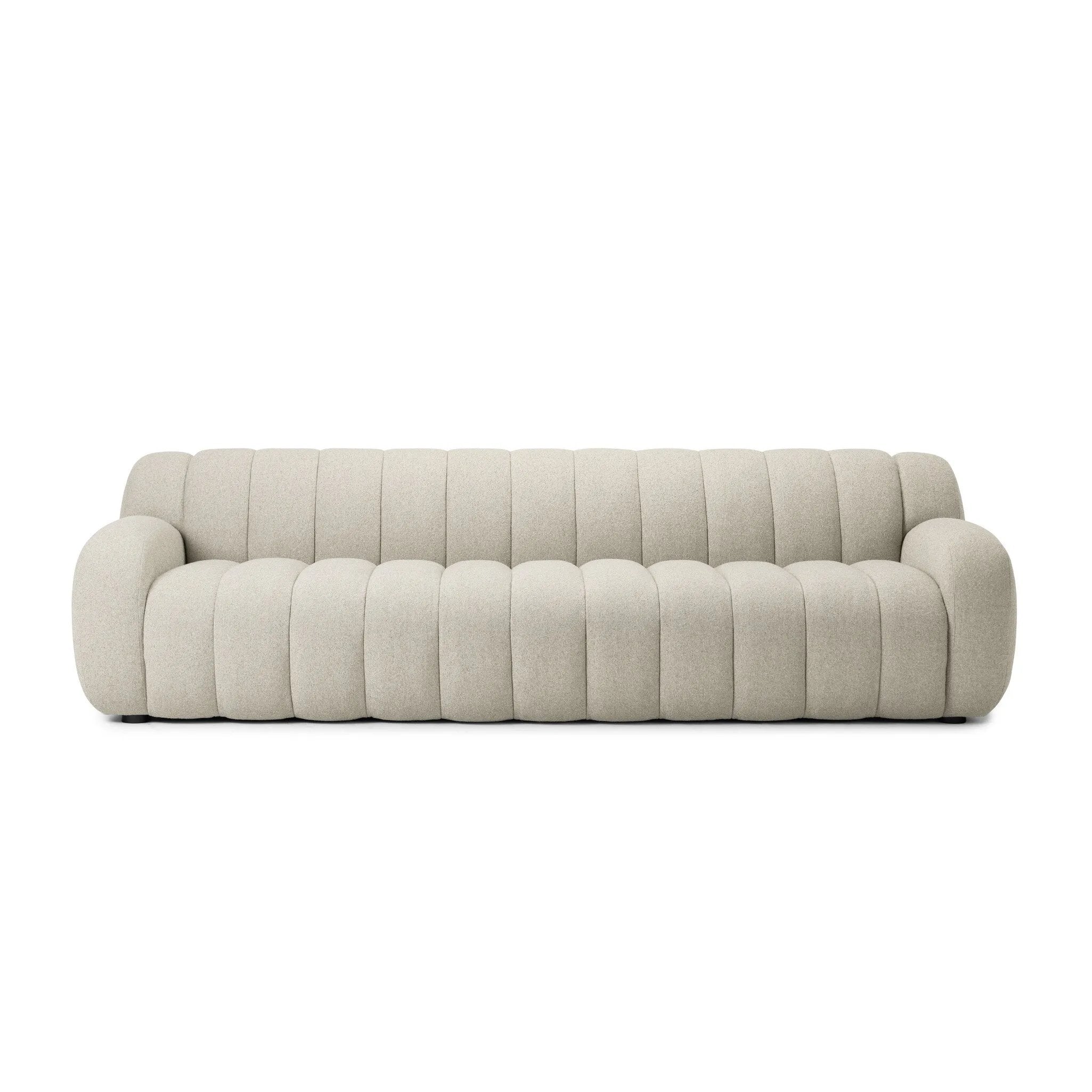 Grand in scale and comfort, this plush sofa features wide dramatic channeling for extra volume and a cloud-like look and sit. Covered in a recycled olefin fabric, known for its UV-resistant, water-repellent and quick-drying abilities, in a Turkish weave with a classic tweed feel.Collection: Osl Amethyst Home provides interior design, new home construction design consulting, vintage area rugs, and lighting in the Omaha metro area.