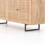 Mid-century-inspired style with an organic twist. Surrounded by mango casing, light cane weaves for a fresh look with natural depth. Angular gunmetal-finished iron legs offer an intriguing contrast of texture and tone. Amethyst Home provides interior design, new construction, custom furniture, and area rugs in the Seattle metro area.