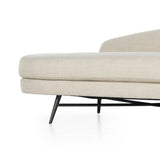 Pristinely upholstered in a cozy, chunky high-performance fabric, soft pill shaping speaks to the grand Parisian inspiration behind this unique statement chaise, with cross-base stretchers and splayed legs of black stainless steel. Performance fabrics are specially created to withstand spills, stains, high traffic and wear, ensuring long-term comfort and unmatched durability. Amethyst Home provides interior design, new construction, custom furniture, and area rugs in the Calabasas metro area.