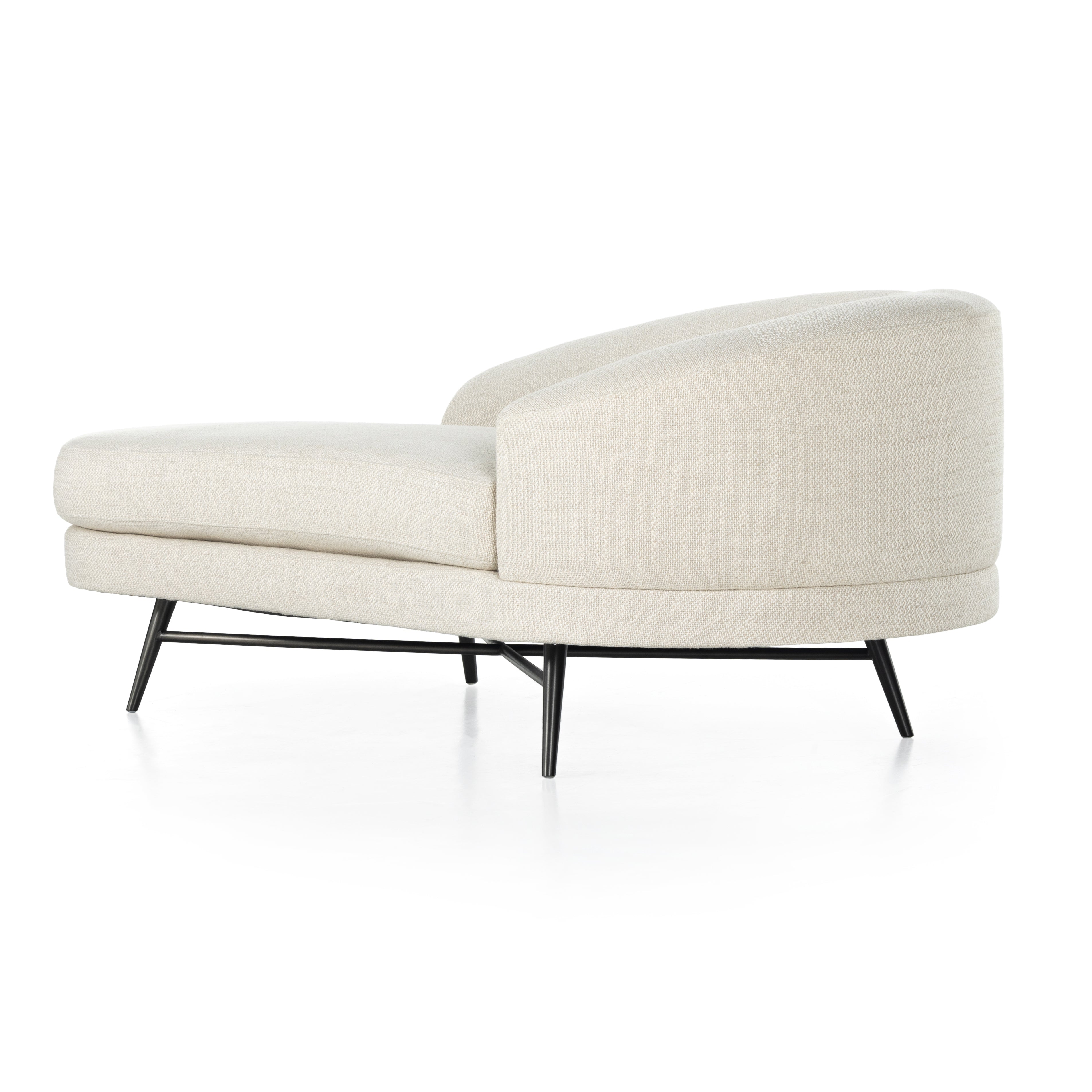 Pristinely upholstered in a cozy, chunky high-performance fabric, soft pill shaping speaks to the grand Parisian inspiration behind this unique statement chaise, with cross-base stretchers and splayed legs of black stainless steel. Performance fabrics are specially created to withstand spills, stains, high traffic and wear, ensuring long-term comfort and unmatched durability. Amethyst Home provides interior design, new construction, custom furniture, and area rugs in the San Diego metro area.