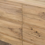 Designed by Thomas Bina and Ronald Sasson, a design partnership blending both modern minimalist and Brazilian influences. This grand-scale dresser is crafted from natural reclaimed French oak with plenty of graining, cracking and movement across the drawer fronts. Detailed with angled legs and exposed joinery on the top. Amethyst Home provides interior design, new home construction design consulting, vintage area rugs, and lighting in the Des Moines metro area.