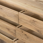 Designed by Thomas Bina and Ronald Sasson, a design partnership blending both modern minimalist and Brazilian influences. This grand-scale dresser is crafted from natural reclaimed French oak with plenty of graining, cracking and movement across the drawer fronts. Detailed with angled legs and exposed joinery on the top. Amethyst Home provides interior design, new home construction design consulting, vintage area rugs, and lighting in the Kansas City metro area.
