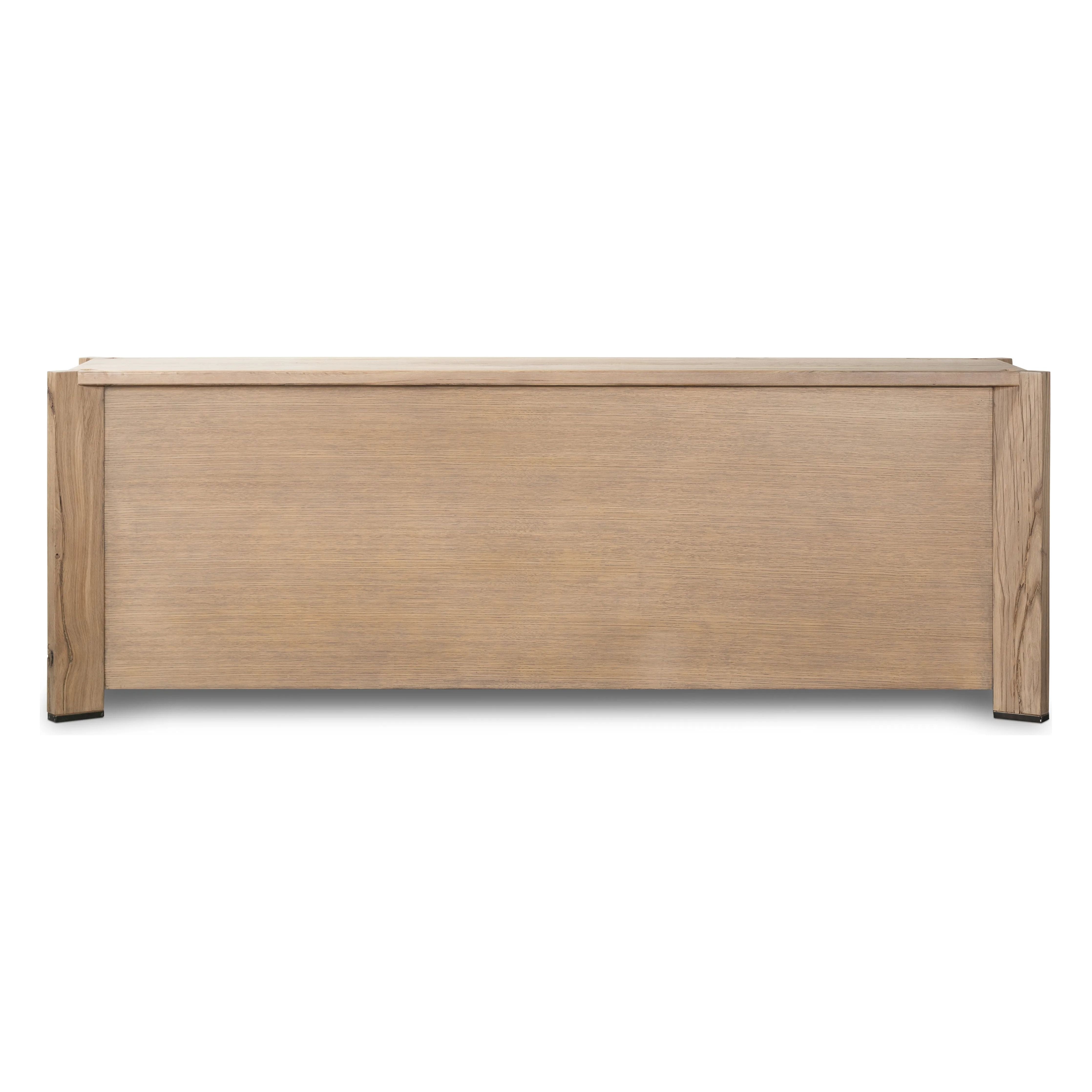 Designed by Thomas Bina and Ronald Sasson, a design partnership blending both modern minimalist and Brazilian influences. This grand-scale dresser is crafted from natural reclaimed French oak with plenty of graining, cracking and movement across the drawer fronts. Detailed with angled legs and exposed joinery on the top. Amethyst Home provides interior design, new home construction design consulting, vintage area rugs, and lighting in the Newport Beach metro area.