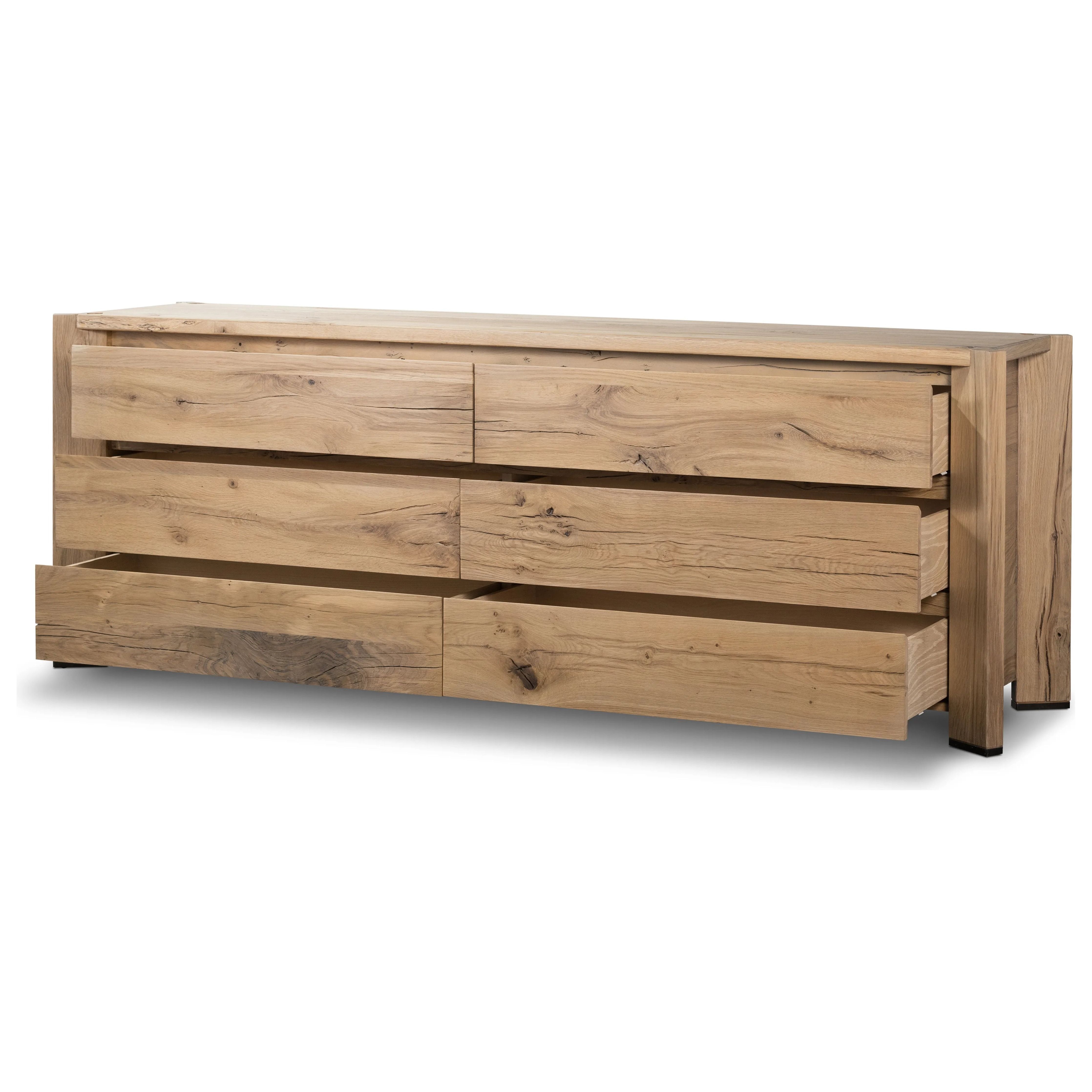 Designed by Thomas Bina and Ronald Sasson, a design partnership blending both modern minimalist and Brazilian influences. This grand-scale dresser is crafted from natural reclaimed French oak with plenty of graining, cracking and movement across the drawer fronts. Detailed with angled legs and exposed joinery on the top. Amethyst Home provides interior design, new home construction design consulting, vintage area rugs, and lighting in the Park City metro area.