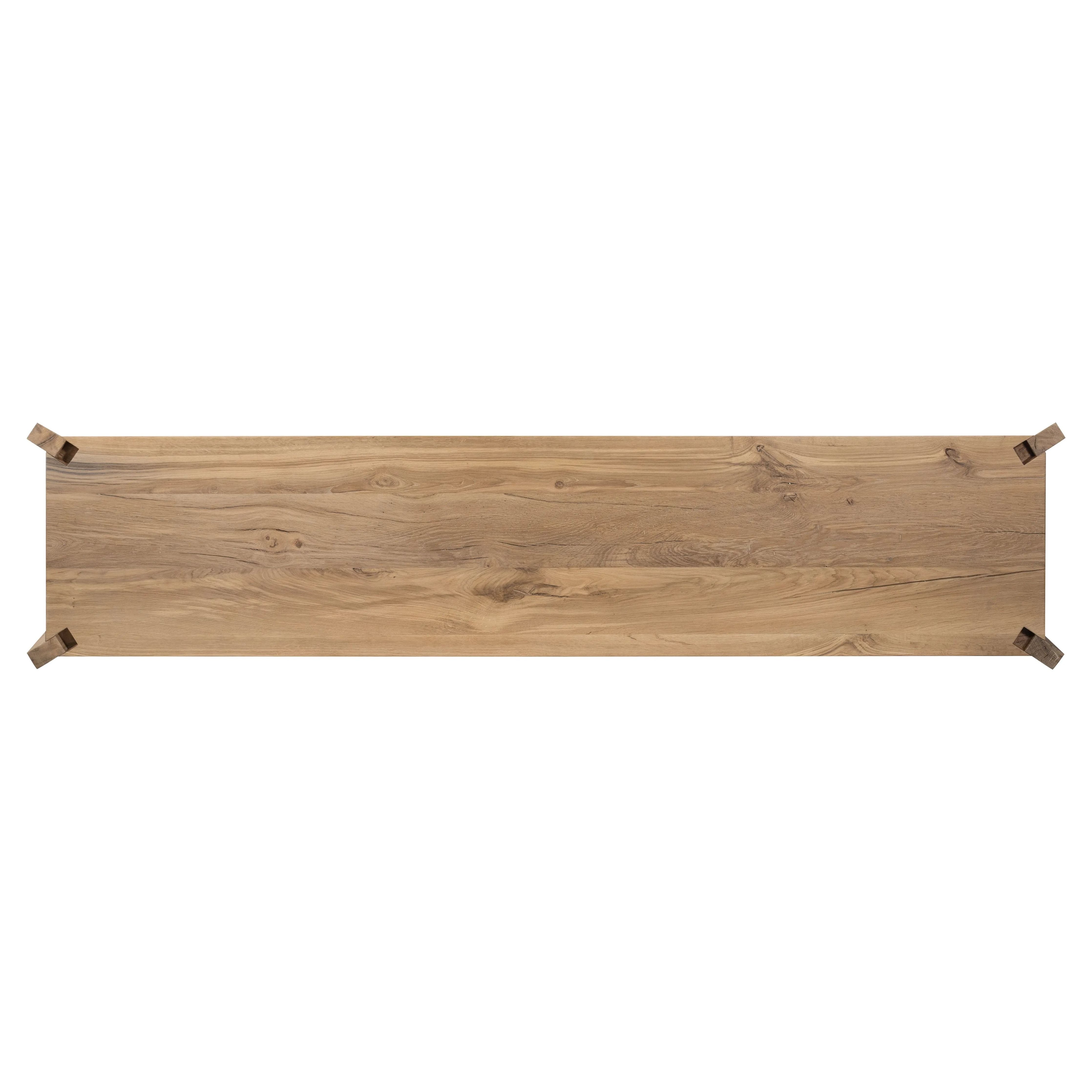 Designed by Thomas Bina and Ronald Sasson, a design partnership blending both modern minimalist and Brazilian influences. This grand-scale dresser is crafted from natural reclaimed French oak with plenty of graining, cracking and movement across the drawer fronts. Detailed with angled legs and exposed joinery on the top. Amethyst Home provides interior design, new home construction design consulting, vintage area rugs, and lighting in the San Diego metro area.