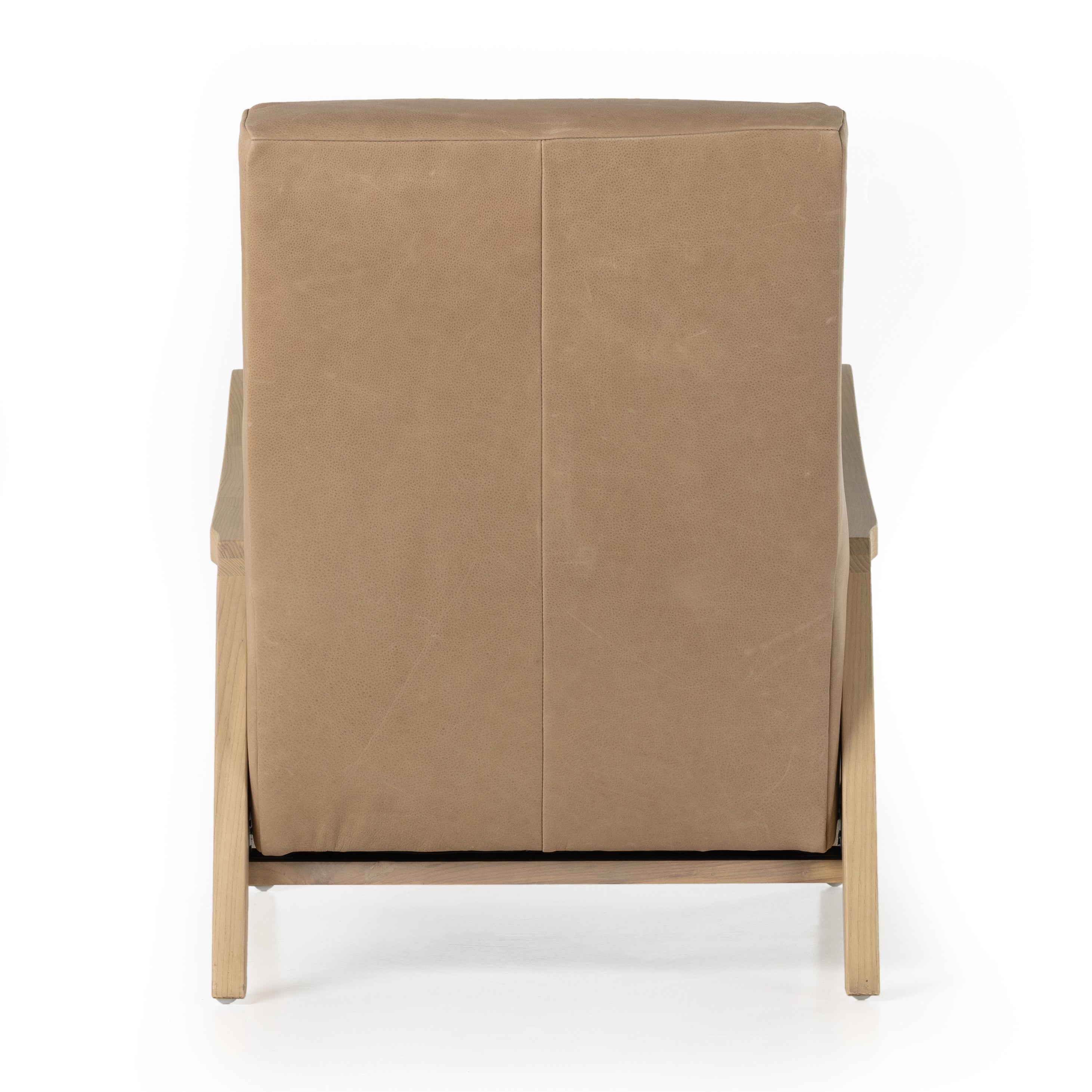 A dramatically shaped midcentury silhouette, modernized with channel tufting. Upholstered in a nude hue top-grain leather with natural whitewashed ash framing for a clean, monochromatic look. A push recliner takes this forward-thinking lounger to the next level. Amethyst Home provides interior design, new construction, custom furniture, and area rugs in the Dallas metro area.