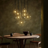 Featuring Cluster Black Cord 7 MIX Burnished Brass Chandelier by Four Hands at Amethyst Home. Clear glass spheres dangle at varying lengths for a stunning effect. Each globe is individually blown, shaped and sculpted by hand through a one-hour process. Brass and glass are 98% recyclable. Designed and sustainably crafted in Poland by Schwung.
Overall Dimensions . Amethyst Home provides interior design, new home construction design consulting, vintage area rugs, and lighting in the Miami metro area.