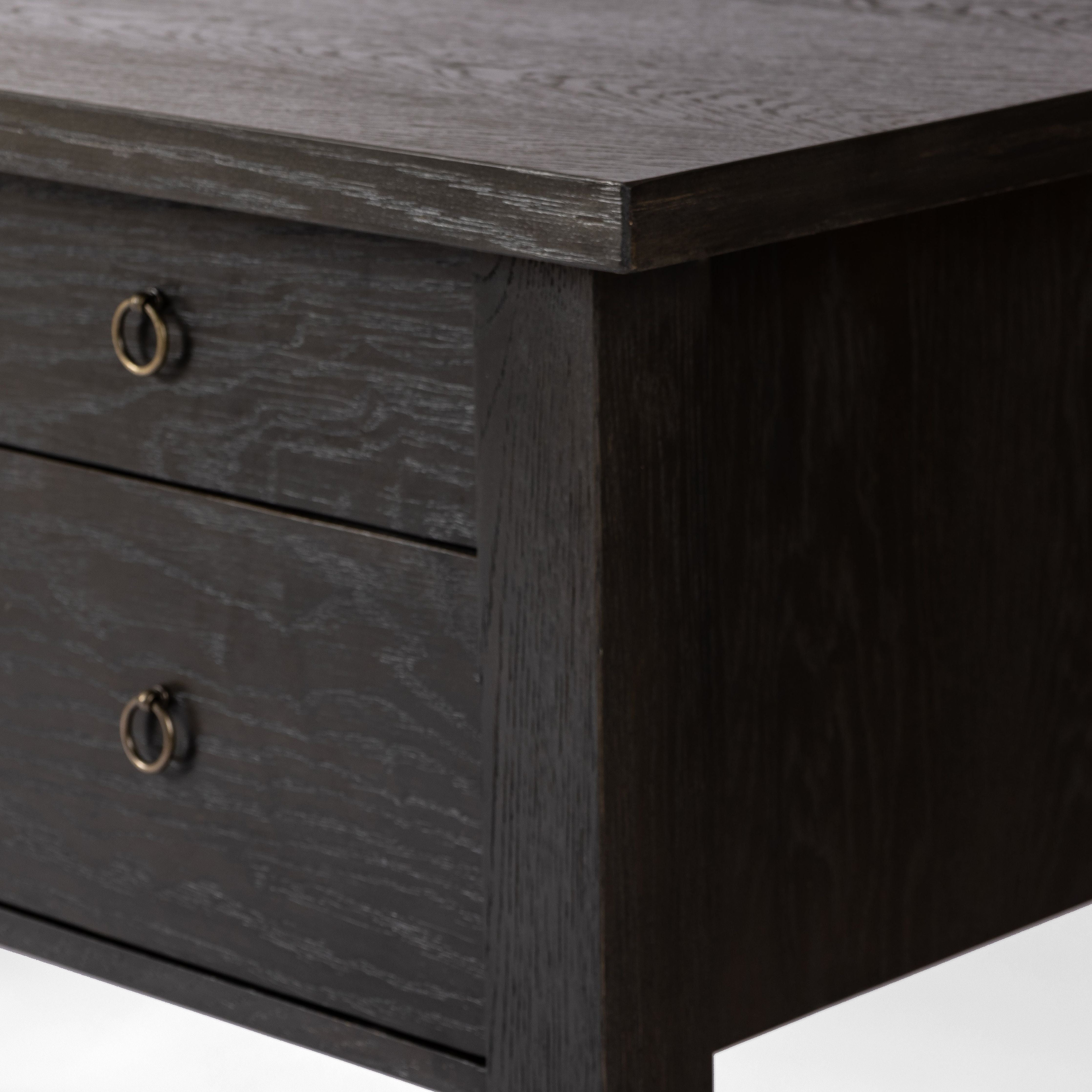 Made from oak veneer with a deep charcoal finish, this executive-size desk delivers ultimate storage, including four drawers on one side plus six open cubbies on the other, granting the option to float-style in a room. Partially turned legs add a design-forward finishing touch. Amethyst Home provides interior design, new construction, custom furniture, and area rugs in the Nashville metro area.