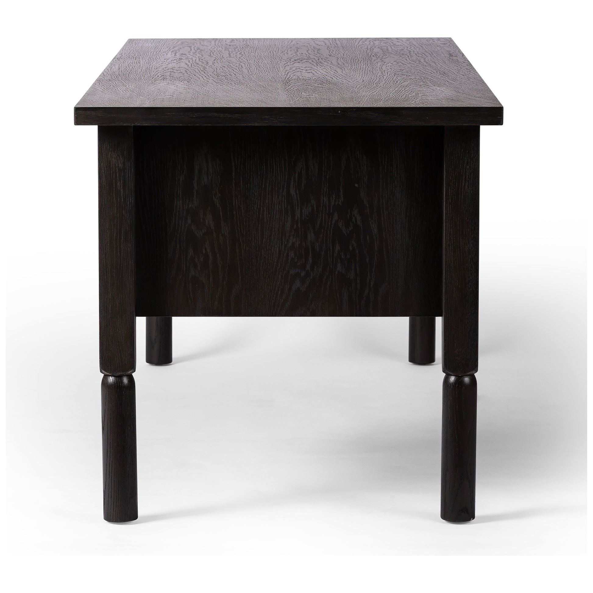 Made from oak veneer with a deep charcoal finish, this executive-size desk delivers ultimate storage, including four drawers on one side plus six open cubbies on the other, granting the option to float-style in a room. Partially turned legs add a design-forward finishing touch. Amethyst Home provides interior design, new construction, custom furniture, and area rugs in the Salt Lake City metro area.
