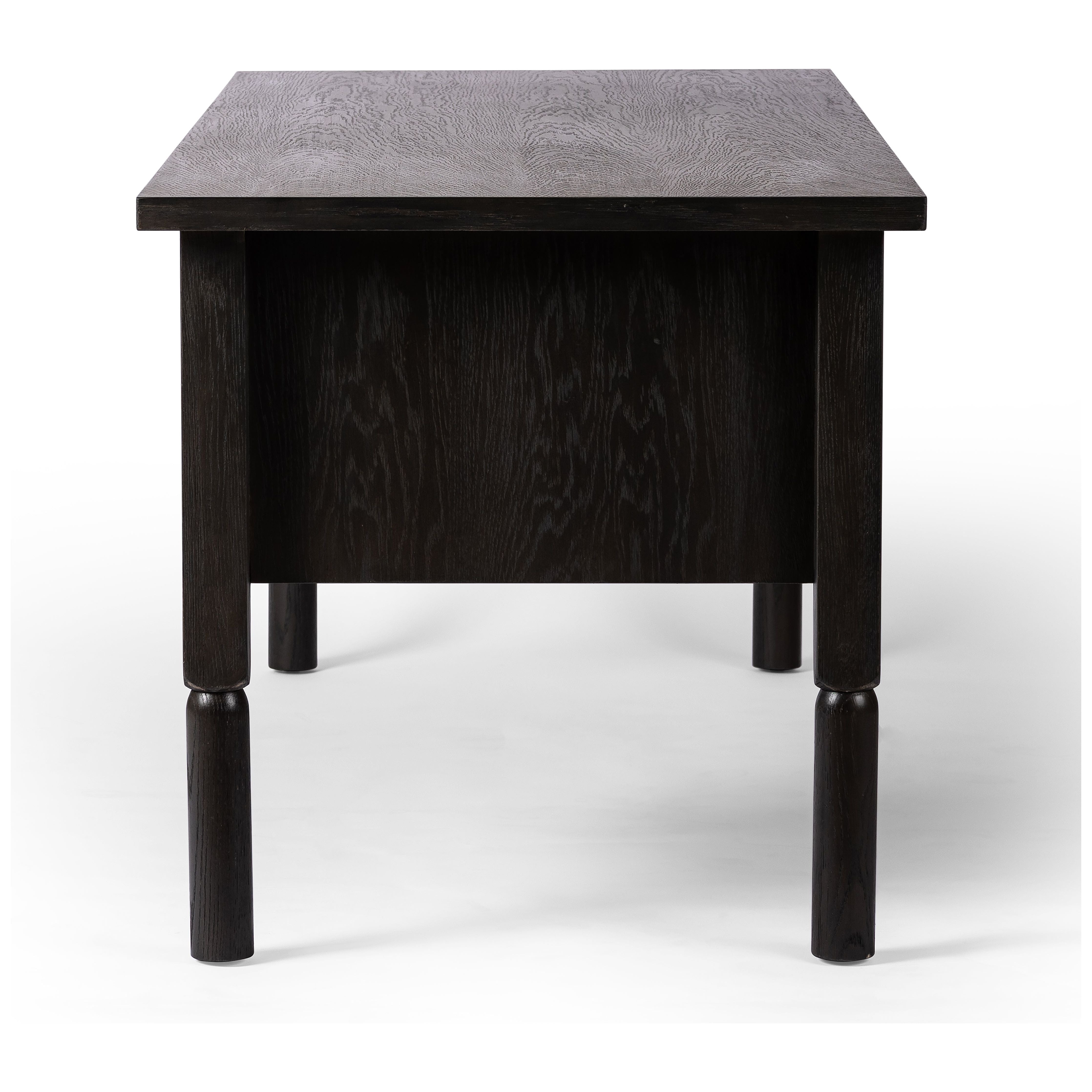 Made from oak veneer with a deep charcoal finish, this executive-size desk delivers ultimate storage, including four drawers on one side plus six open cubbies on the other, granting the option to float-style in a room. Partially turned legs add a design-forward finishing touch. Amethyst Home provides interior design, new construction, custom furniture, and area rugs in the Salt Lake City metro area.