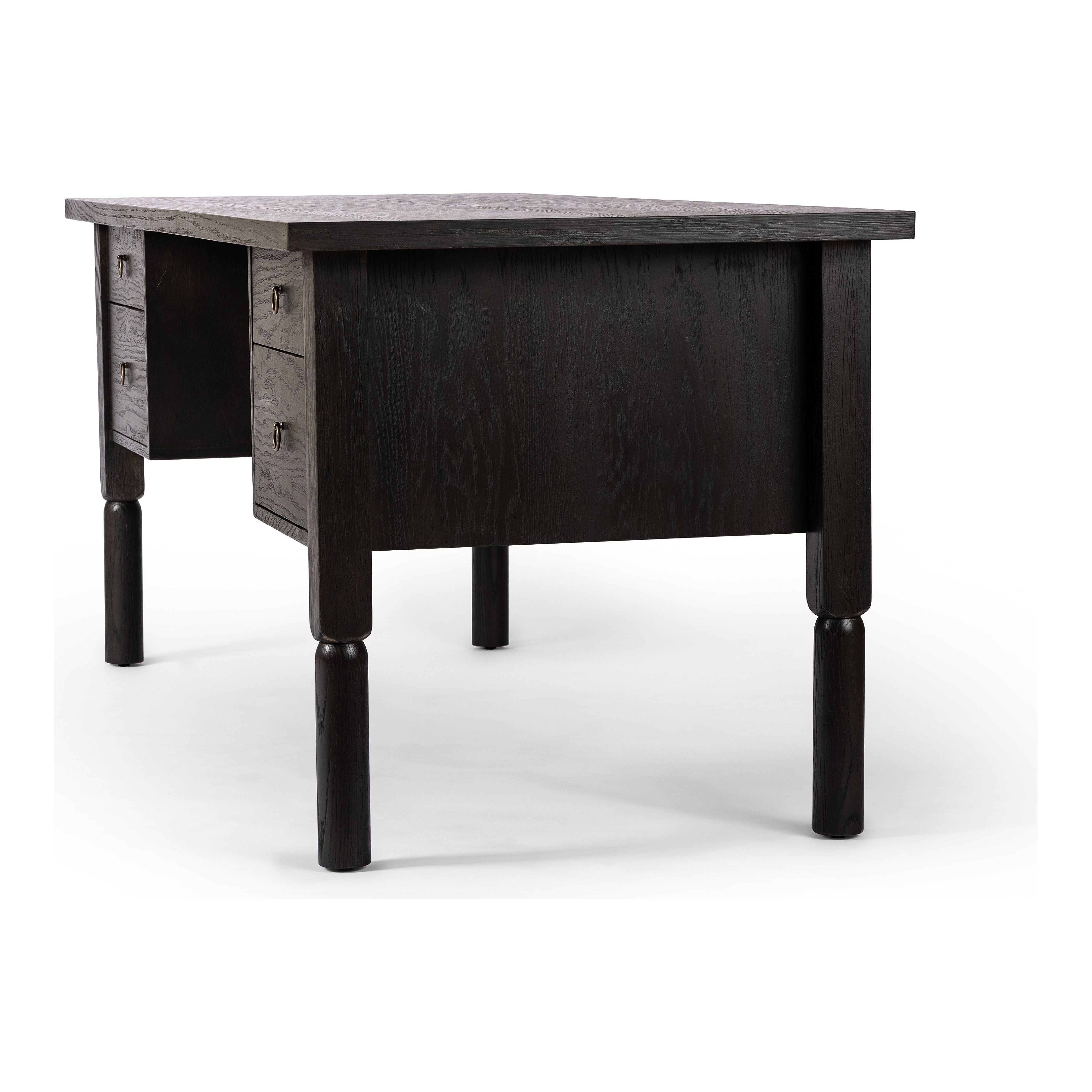 Made from oak veneer with a deep charcoal finish, this executive-size desk delivers ultimate storage, including four drawers on one side plus six open cubbies on the other, granting the option to float-style in a room. Partially turned legs add a design-forward finishing touch. Amethyst Home provides interior design, new construction, custom furniture, and area rugs in the San Diego metro area.