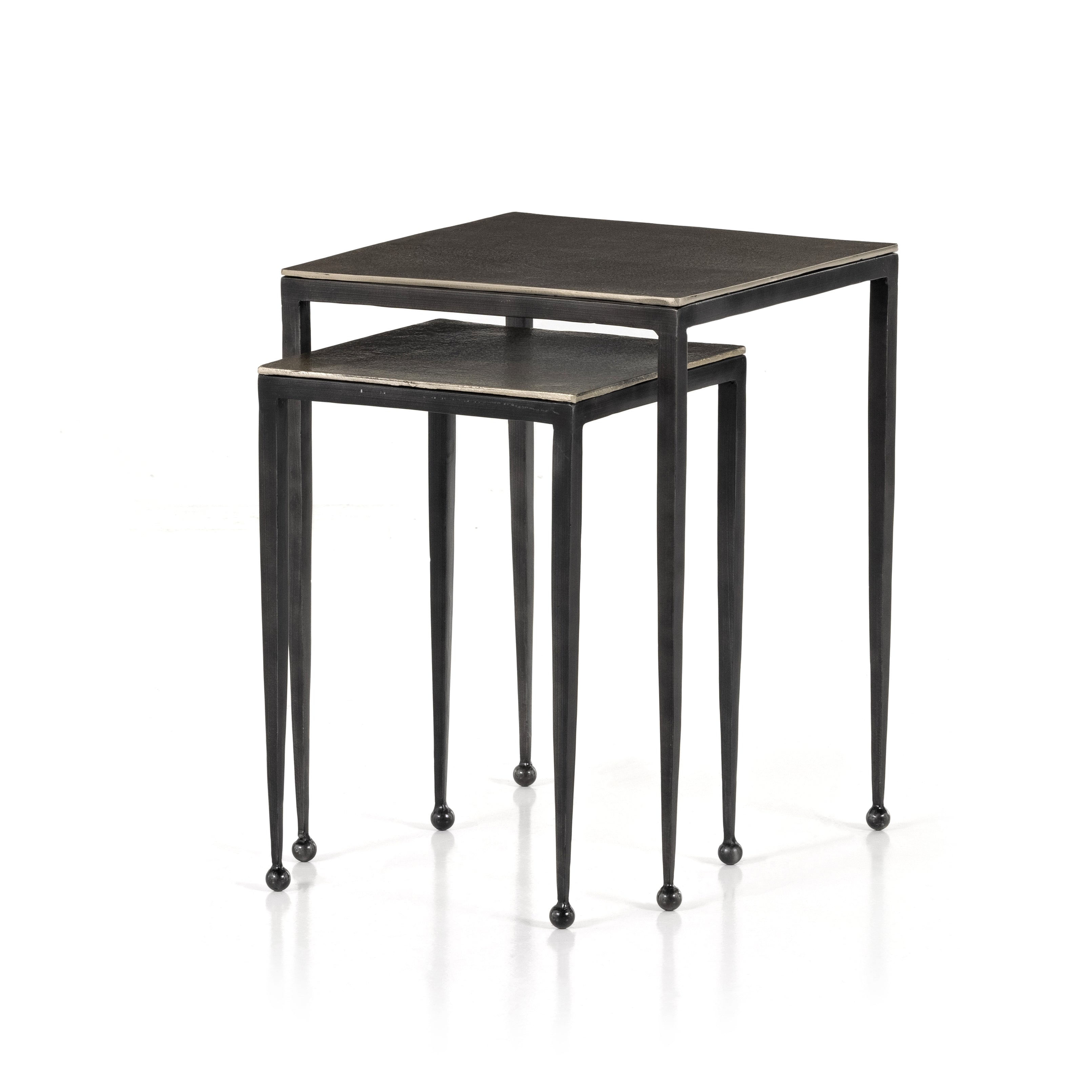 Slender styling adopts depth from swirls of vintage tones. Tapered legs with rounded feet bring balanced footing to streamlined shaping. Aluminum tops are squared-off and finished in an antique nickel. 
Â 
Large nesting table measures 16"W x 21.25"H. 
Small table measures 12.5"W x 18.25"H. Amethyst Home provides interior design, new construction, custom furniture, and area rugs in the Tampa metro area.